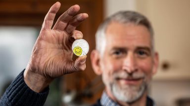 Adam Hargreaves, son of Mr Men and Little Miss creator Roger Hargreaves, holds The Royal Mint's new £5 Mr Happy coin, which launches today to celebrate 50 years of the characters